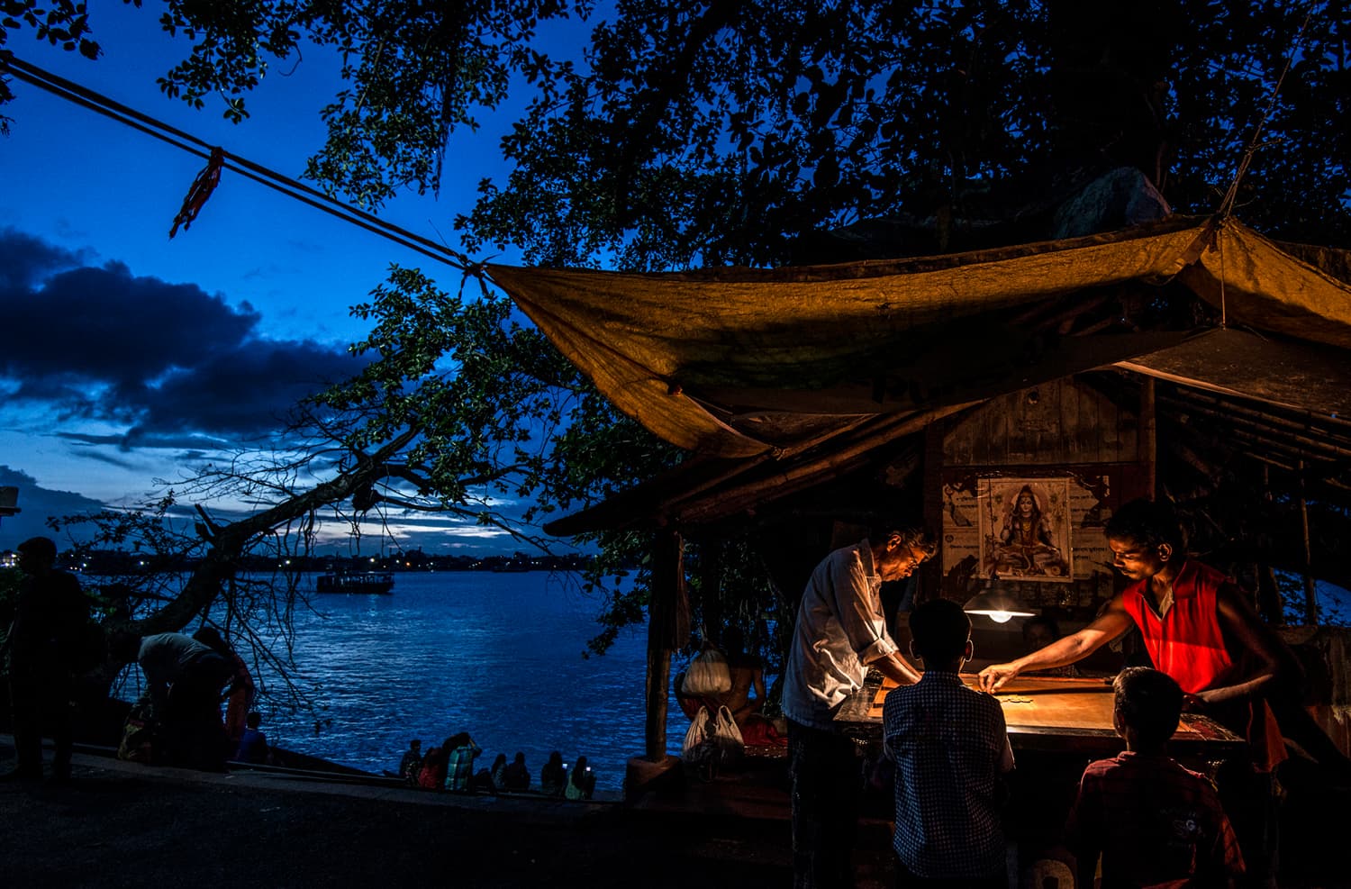 Evening riverside stall beside blue water